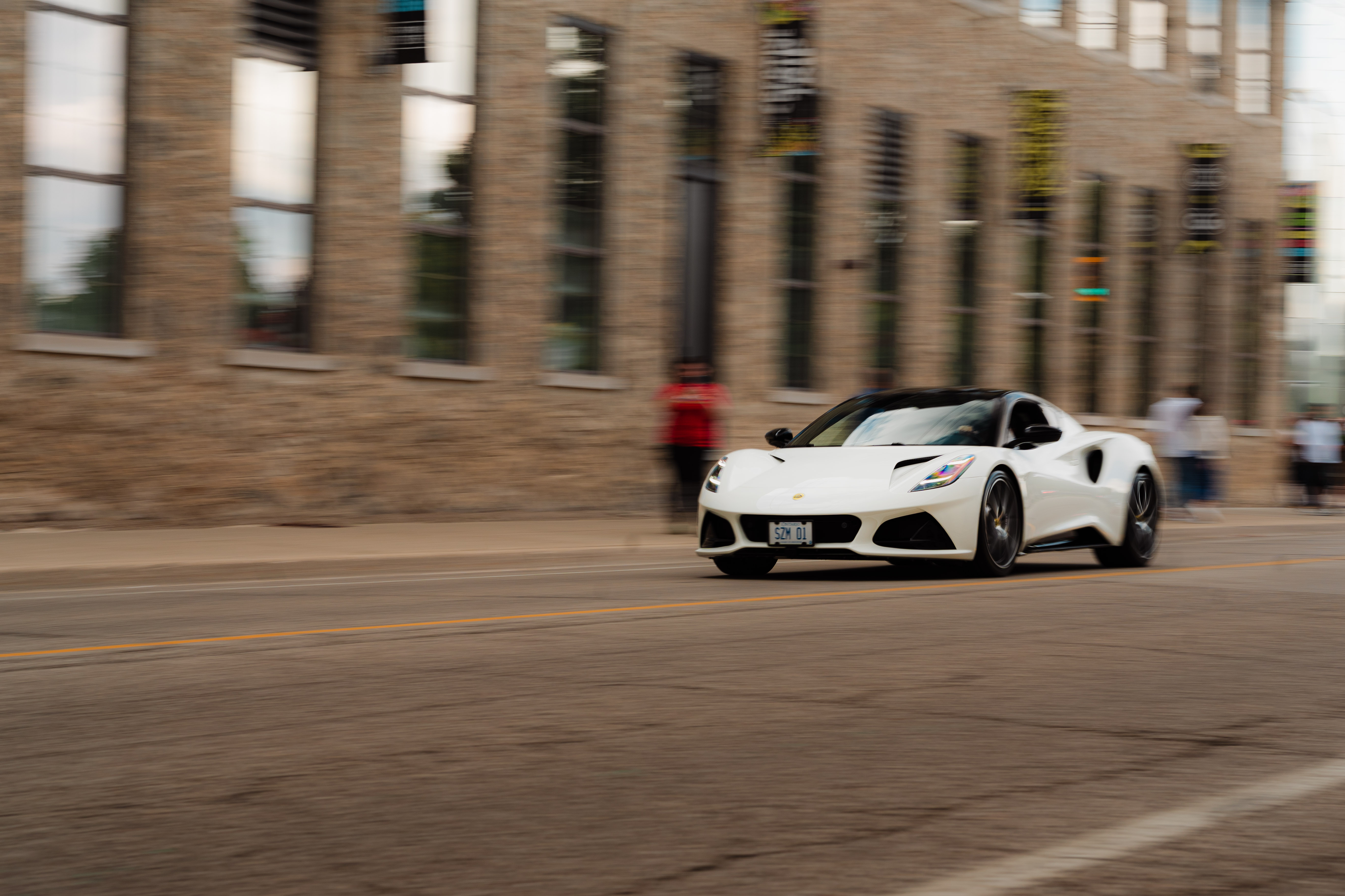 A white sports car driving through Cambridge
