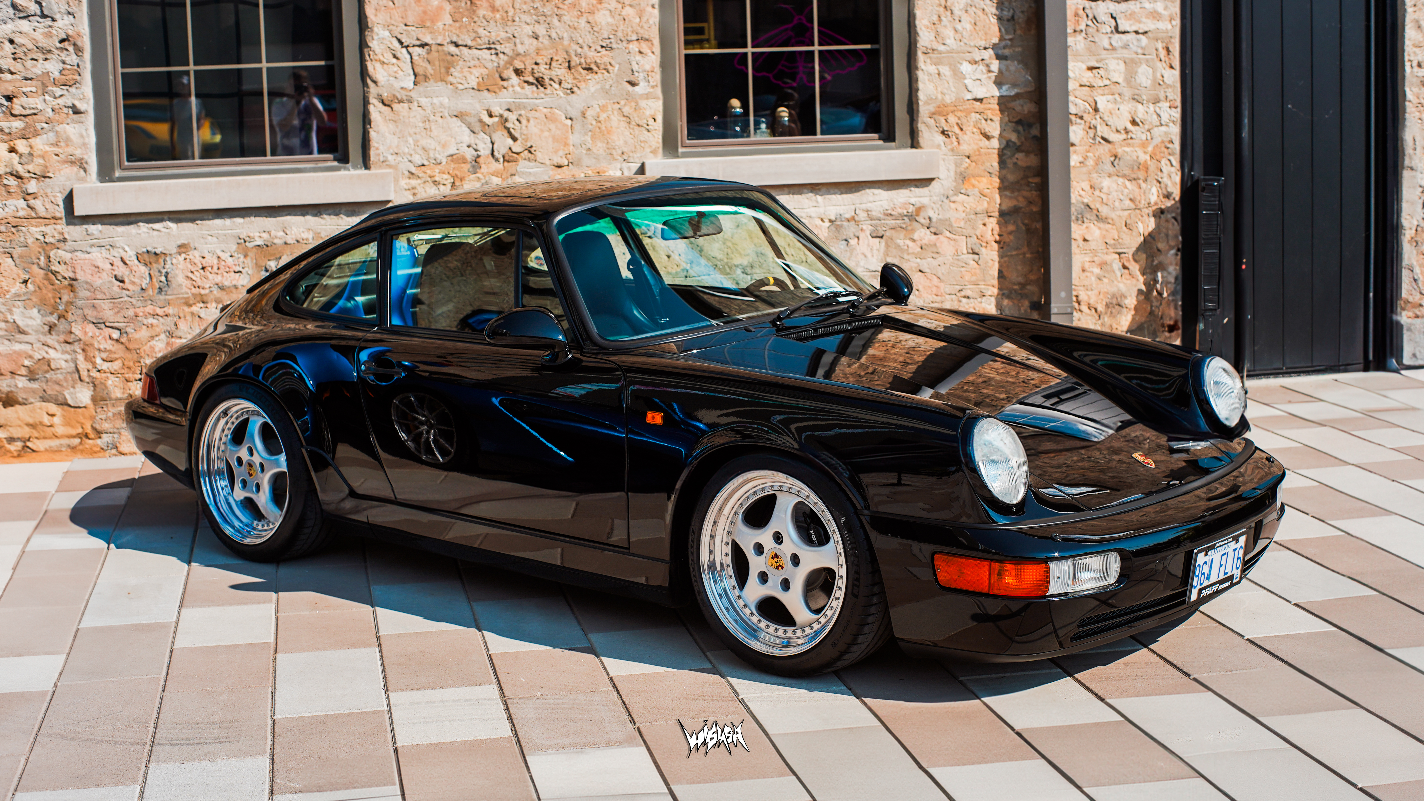 A black Porsche 911 in the Gaslight District