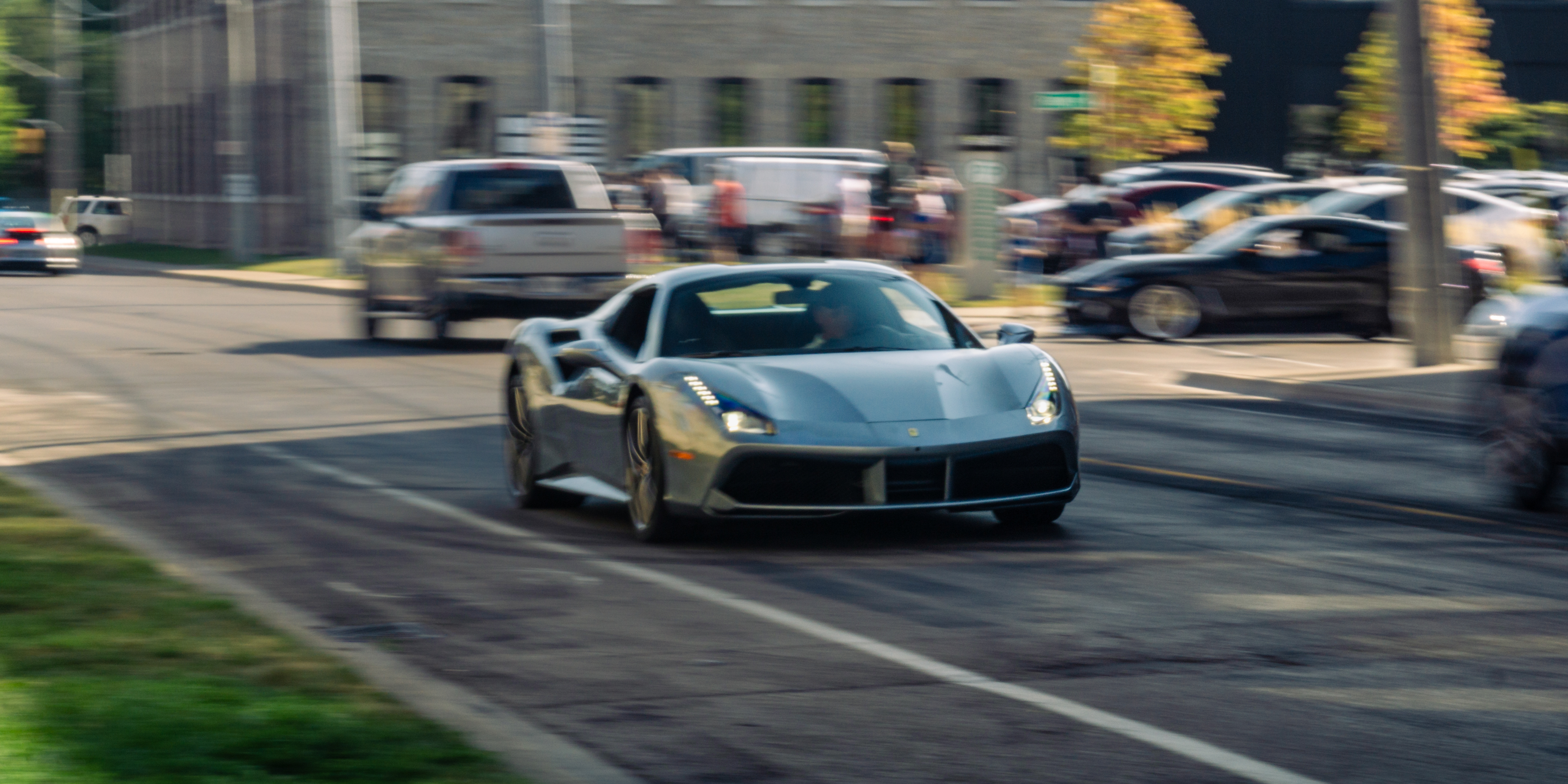 A silver Ferrari moving through Cambridge