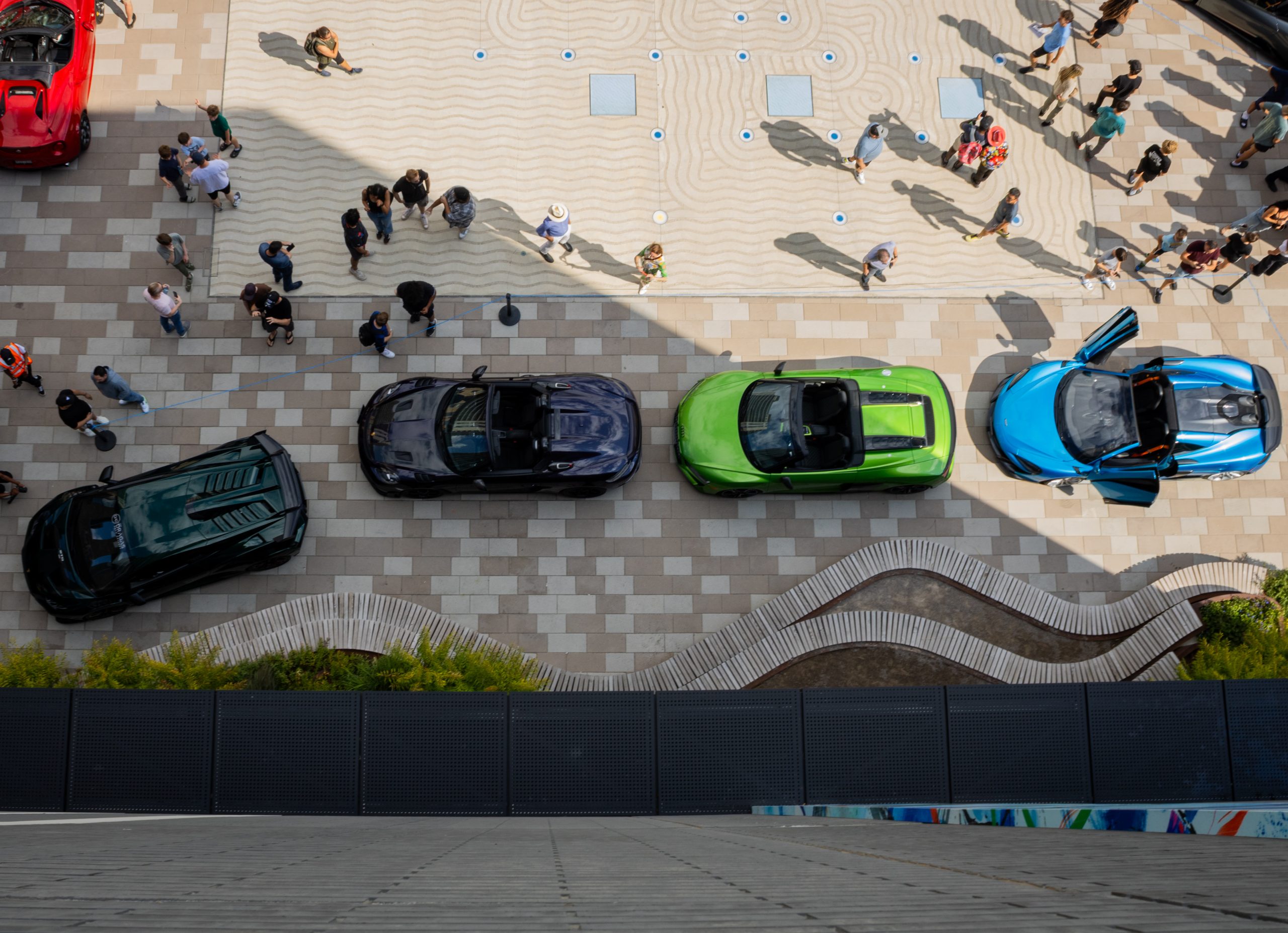 Night shot of cars and neon lighting at the event